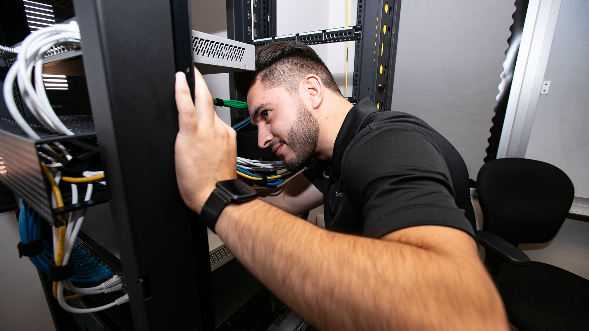 Cybersecurity person working on equipment